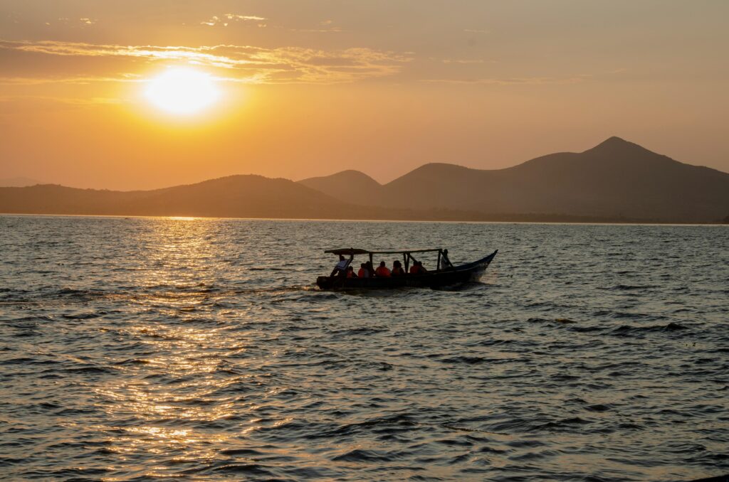 Scenic view of a boat at sunset on Lake Victoria near Homa Bay, Kenya.